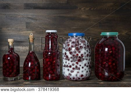 Homemade Tincture Of Red Cherry. Berry Alcoholic Drinks Concept. Red Wine Made From Ripe Cherries In