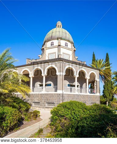 Catholic Church of the Beatitudes of the Franciscan monastery. The Mount Bliss on the Sea of Galilee. Israel. Blooming huge park around the monastery. The concept of religious pilgrimage 
