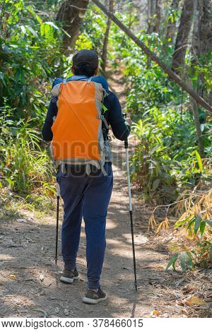 Traveler Man Hiking Enjoying In The Mountains With Backpack At Khao Chang Puak Mountain Thailand