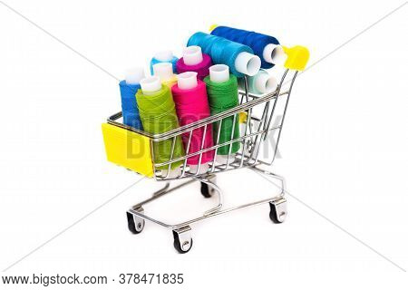 Many Colored Threads In A Shopping Cart On A White Background. Sale.
