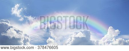 Stunning Blue Sky Panoramic Rainbow - Big Fluffy Clouds With A Giant Arcing Rainbow Against A  Beaut