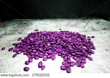 Lot Of Coffee Beans On A Concrete Board