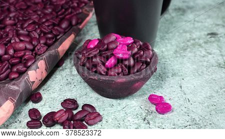 A Clay Pot With Coffee Beans On A Concrete Board