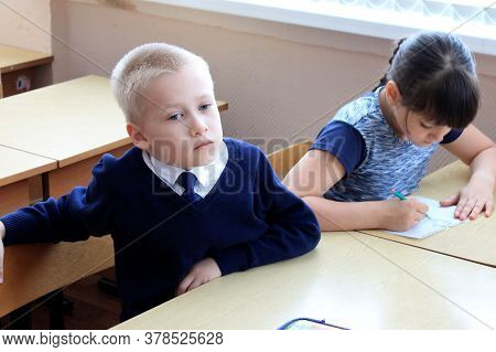 Moscow, Russia - September 1, 2017: Schoolboy, Pupil Sitting At The Desk In Class At School, Traditi
