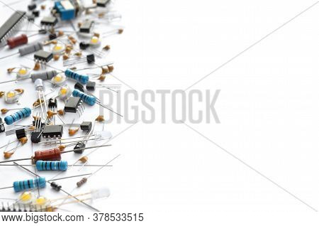 Different Electronic Components On White Background With Copy Space. Selective Focus