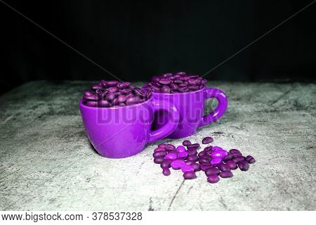 Ceramic Espresso Cups And Coffee Beans On A Concrete Board