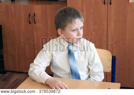 Moscow, Russia - September 1, 2017: Schoolboy, Pupil Sitting At The Desk In Class At School, Traditi