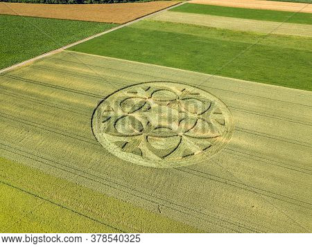 Canton Bern, Switzerland - July 05, 2019: Mysterious Crop Circle Emerged Overnight In Wheat Field Wi