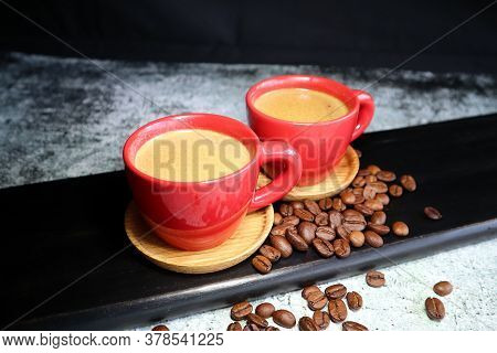 Ceramic Espresso Cups With Coffee On A Black Wooden Board