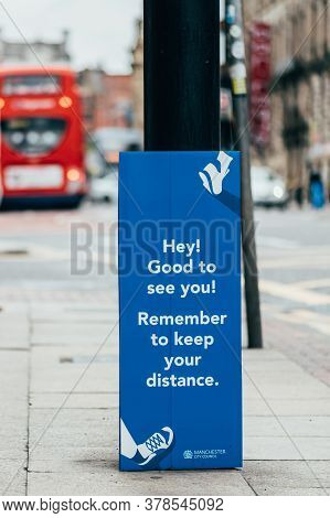 Manchester, England, Uk - 24 July, 2020 City Centre Of Manchester, Board With Reminder To Keep Dista