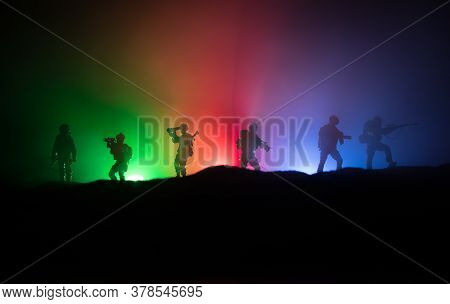 Azeri Army Concept. Silhouette Of Armed Soldiers Against Azerbaijani Flag. Creative Artwork Decorati
