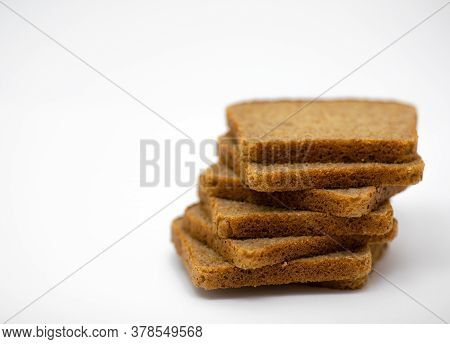 Seven Pieces Of Wholemeal Bread On A White Background