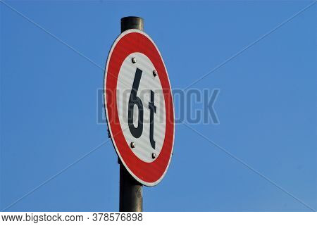Traffic Sign 6t White With Red Edge In Front Of Blue Sky Asbackground