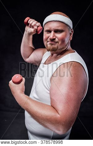 A Plump Man Works Out With Two Small Dumbbells. He Is Wearing A White Tracksuit And Looks Very Funnn