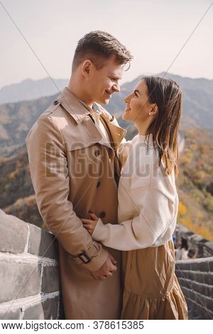 Beautiful Young Couple Showing Affection On The Great Wall Of China