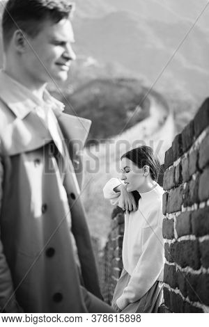 Beautiful Young Couple Posing At The Great Wall Of China