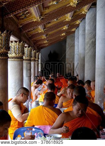 Bangkok, Thailand, September 22, 2015: Buddhist Monks Eat In The Courtyard Of The Wat Benchamabophit