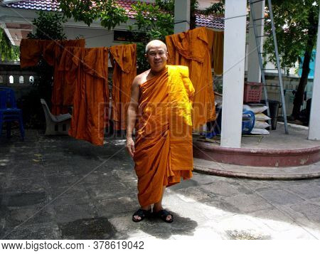 Bangkok, Thailand, September 9, 2015: Smiling Buddhist Monk  In The Courtyard Of His Home In Bangkok