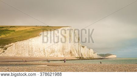 Dramatic White Cliffs And Shingle Beach At Cuckmere Haven, Seven Sisters Country Park, Brighton
