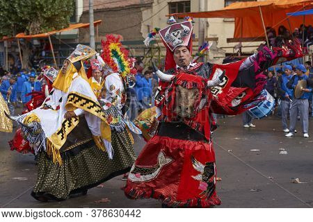 Oruro, Bolivia - February 25, 2017: Members Of A Waca Waca Dance Group In Ornate Costume Parade Thro