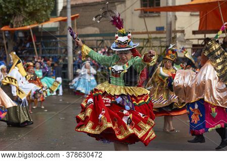 Oruro, Bolivia - February 25, 2017: Members Of A Waca Waca Dance Group In Ornate Costume Parade Thro