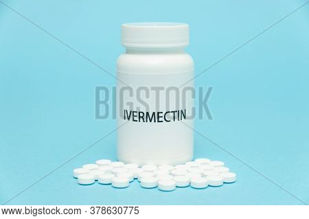 Treatments For Coronavirus (covid-19): Ivermectin In White Bottle Packaging With Scattered Pills. Is