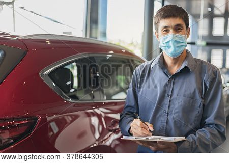 Asian Saleman Wear Surgical Mask Working In Inspector Checking Writing On Clipboard In Garage Of Dea
