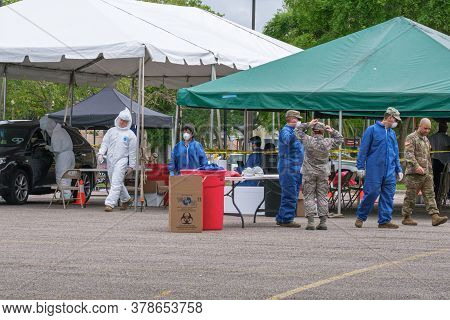 New Orleans, La/usa - 3/21/2020: Health Workers Conducting Covid-19 Drive Thru Testing At Mahalia Ja
