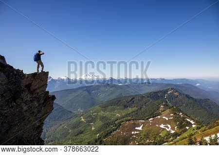 Adventurous Person Hiking In The Canadian Mountains During A Sunny Summer Morning. Taken On The Trai