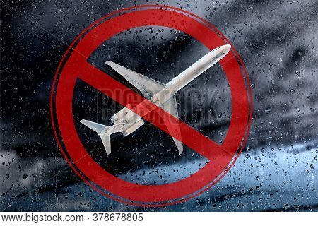 The Plane Against A Background Of Thunderclouds And A Prohibiting Symbol Of Red Color. The Concept O