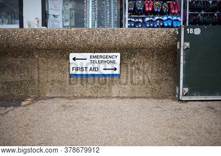 Hunstanton, Norfolk, England, Uk - July 25, 2020: Information Sign - Emergency Telephone, First Aid 