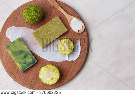 Two Pieces Of Natural Osage Orange Fruit Scrub Soap For Spa Treatments, And An Adam Apple Fruit, Top