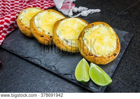 Delicious Lebanese Food, Sfiha Au Gratin With Labneh And Cheese On Black Slate Stone Background And