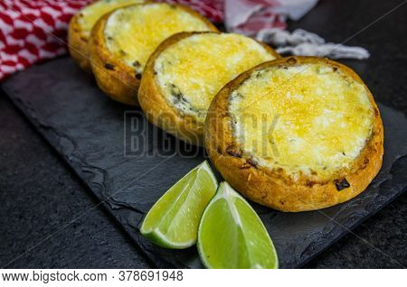 Delicious Lebanese Food, Sfiha Au Gratin With Labneh And Cheese On Black Slate Stone Background And