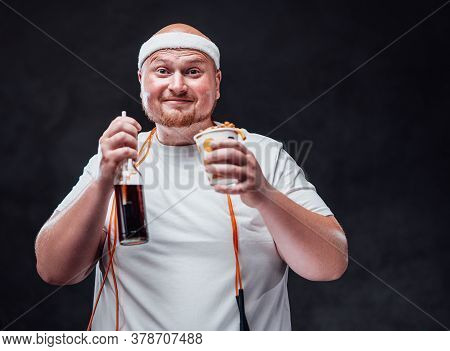 Funny Fat Man In A White Duffle, Eating French Fries With Sauce With A Big Pleasure , Drinking Coca 