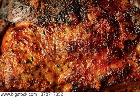 Highly Browned Crust On A Freshly Prepared Piece Of Pork Close Up