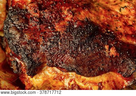 Highly Browned Crust On A Freshly Prepared Piece Of Pork Close Up