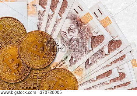 200 Czech Korun Bills And Golden Bitcoins. Cryptocurrency Investment Concept. Crypto Mining Or Tradi