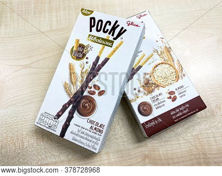 Bangkok Thailand - 30 July 2020: Glico Pocky Wholesome Biscuit Sticks Box New Flavour On The Wood Ta