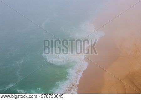 Sea And Sandy Beach In Dense Fog, Autumn Day