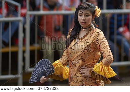Oruro, Bolivia - February 25, 2017: Members Of A Waca Waca Dance Group In Ornate Costume Parade Thro