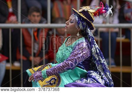 Oruro, Bolivia - February 25, 2017: Members Of A Waca Waca Dance Group In Ornate Costume Parade Thro