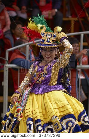 Oruro, Bolivia - February 25, 2017: Members Of A Waca Waca Dance Group In Ornate Costume Parade Thro