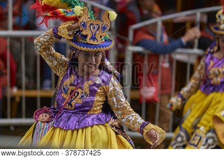 Oruro, Bolivia - February 25, 2017: Members Of A Waca Waca Dance Group In Ornate Costume Parade Thro