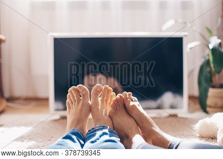 Couple Sitting In Home Tent Watching Tv. Couple In Love. Watch Tv. Man And Woman Home Concept. Movie