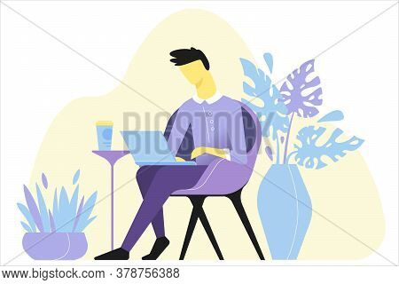 A Man Works Remotely. The Guy Is Working And Drinking Coffee. He Spends Time On A Laptop. The Guy Ke