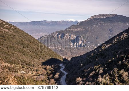 Squirm Mountain Road In Valley Leading Further Into The Mountains