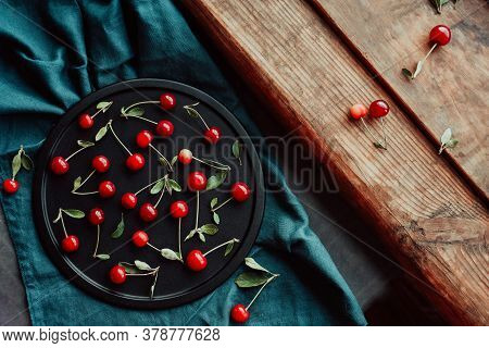 Ripe Cherries On A Black Dish. Cottagecore Aesthetics. Rustic, Vintage Style Harvest Season Concept