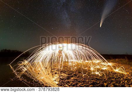 Long Exposure Of Spinning Steel Wool In Abstract Circle Making Firework Showers Of Yellow Glowing Sp