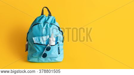 Back To School Concept During Corona Pandemic. Schoolbag With Medical Masks, Disinfectant And Pencil